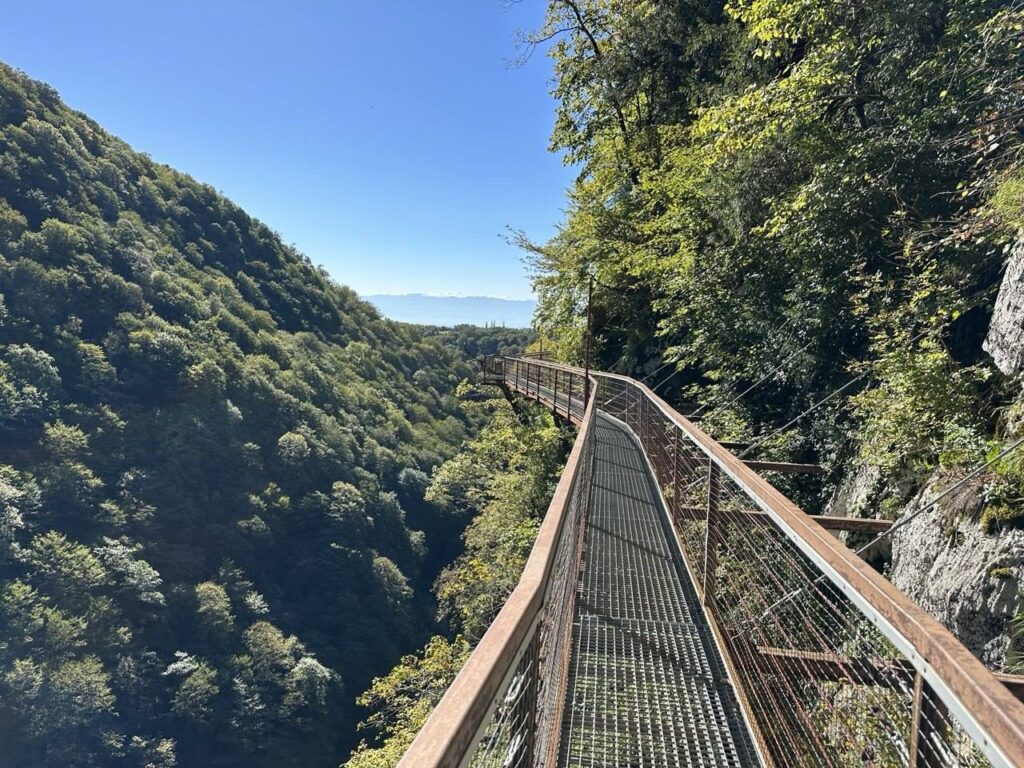 The metal walkway along the cliff in Okatse Canyon